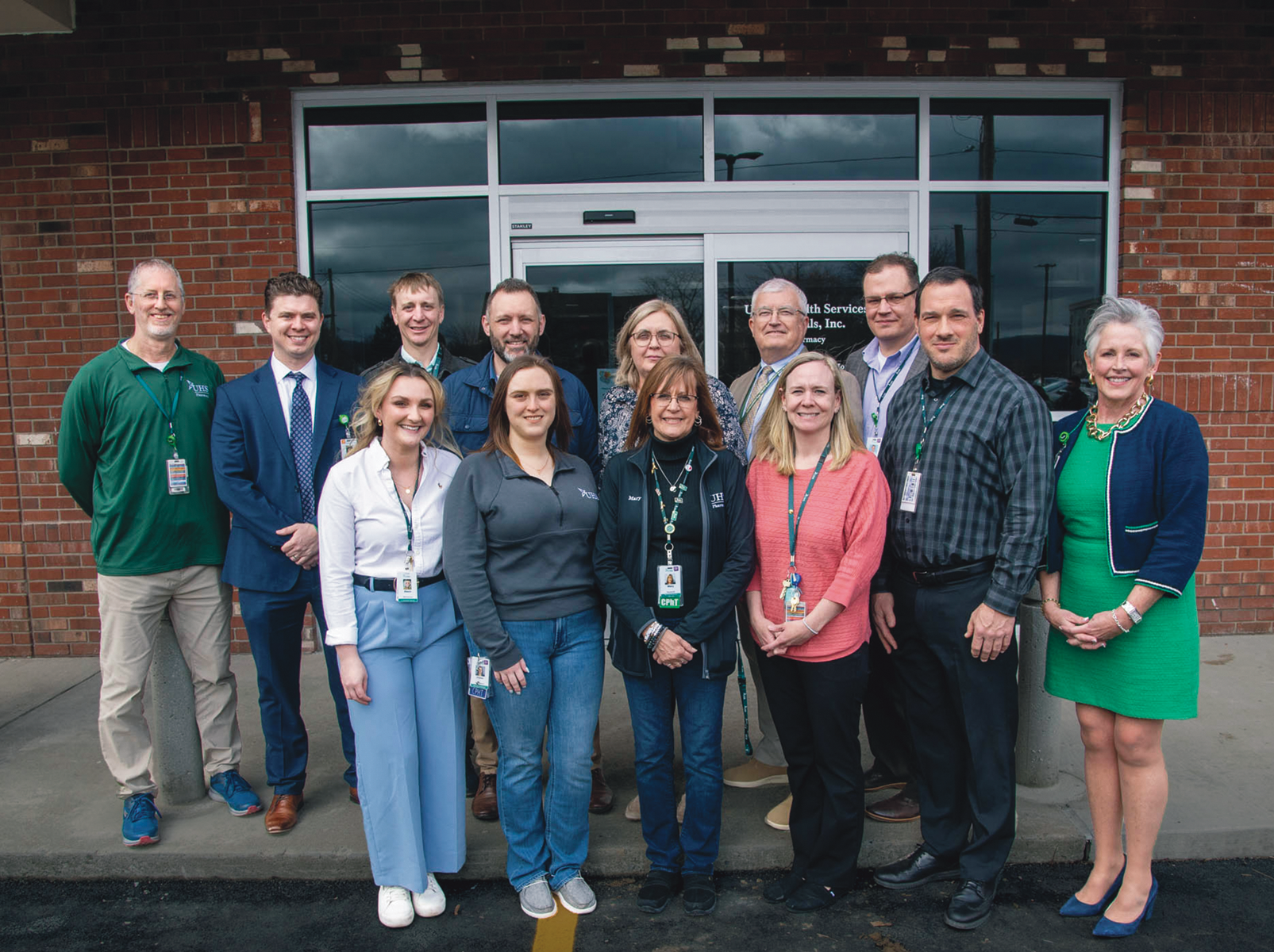 UHS Pharmacy Team standing in front of the building