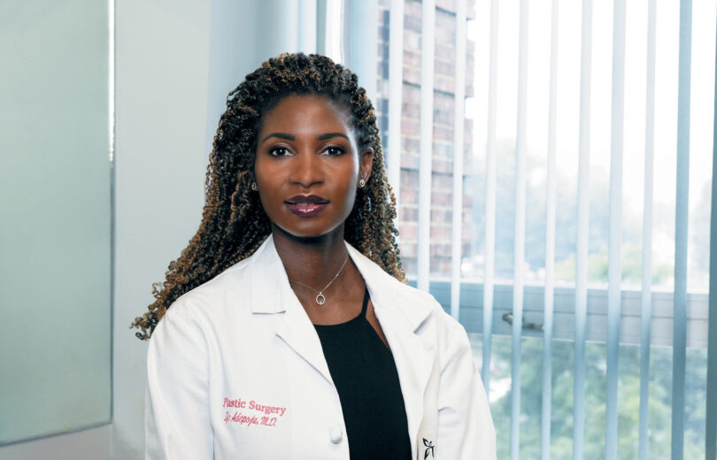 Female doctor looking straight into the camera.