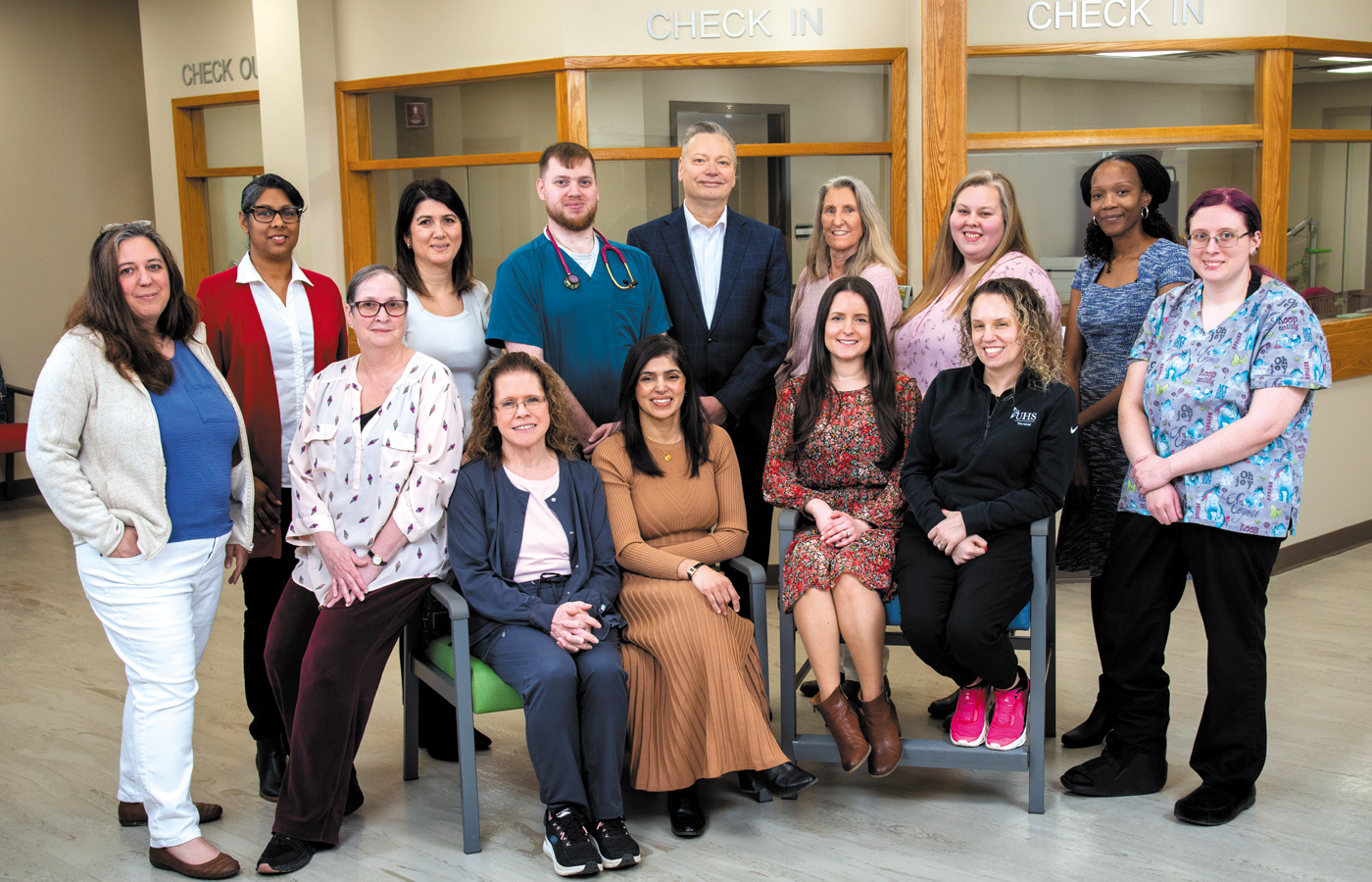 Multiple hospital employees pose for a group photo at the new UHS Upper Front Street facility.